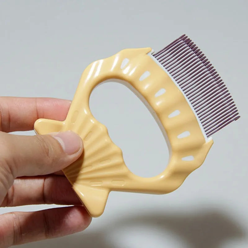 Green shell-shaped pet grooming brush with fine wire bristles on a white background.