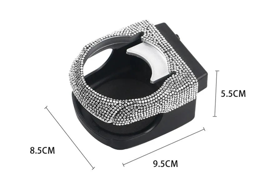 White diamond decorated car cup holder bracket mounted on a vehicle air vent.