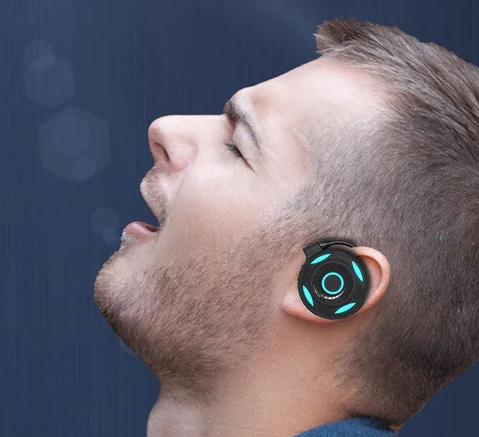 Black wireless Bluetooth earphones with hanging ear design showing ear hooks and USB charging port