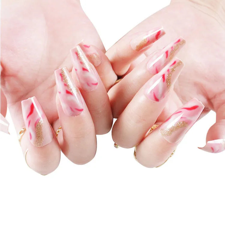 Wearable manicure set showing 24 artificial nails with rose, tulip, leopard and XINGX designs