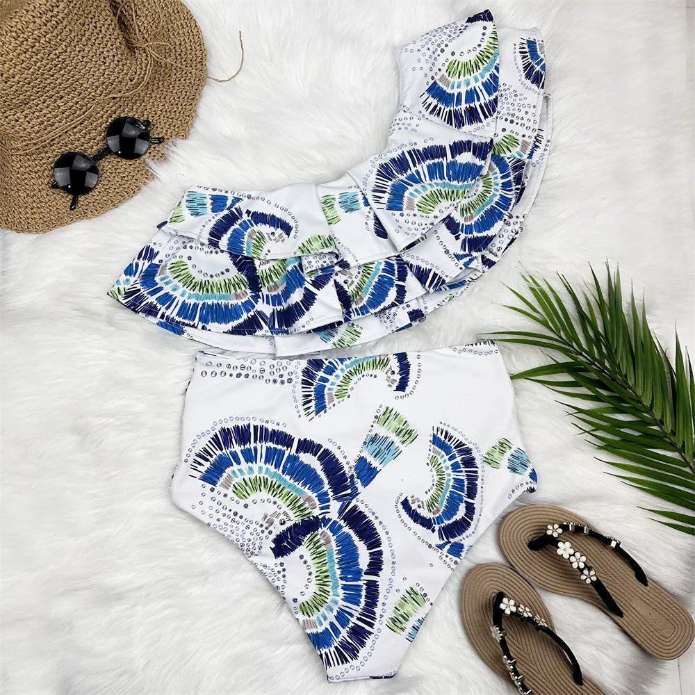 White women's one-shoulder swimsuit with lotus leaf detail and split side design