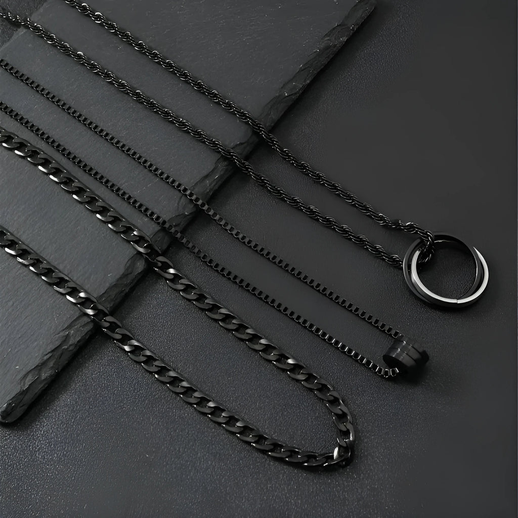 Men's black titanium steel ring buckle necklace set with three matching geometric stainless steel chains.
