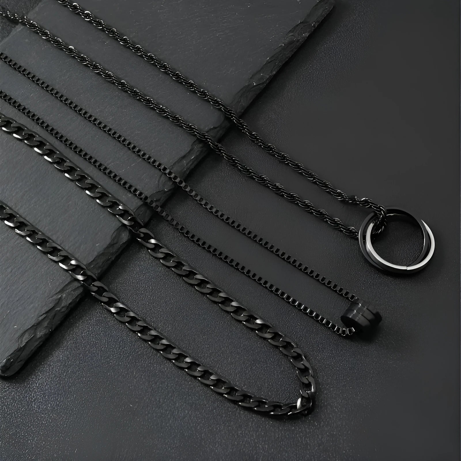 Men's black titanium steel ring buckle necklace set with three matching geometric stainless steel chains.
