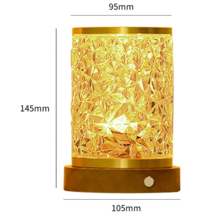 Compact rotating water ripple effect LED night light with solid wood base on a bedside table.