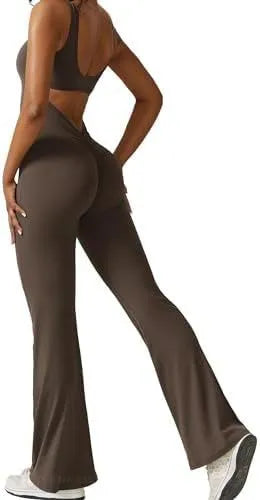 Woman wearing a sleeveless army green flare-leg jumpsuit for yoga fitness.