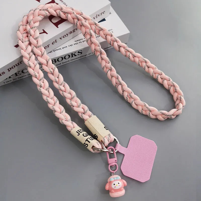 Woven nylon crossbody phone lanyard with macaron pendant in Pink Dot Gray, showing three-strand horse tail detail and matching clip.