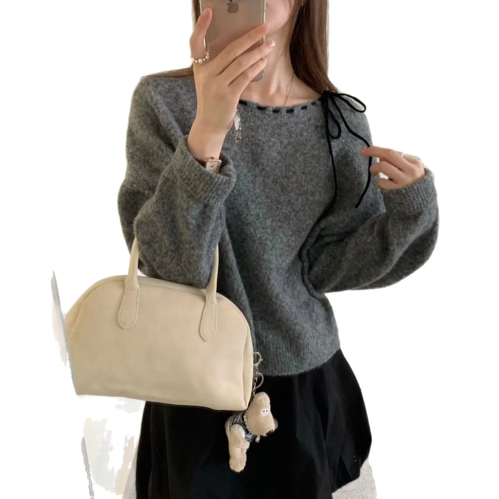 A grey women's loose-fitting pullover knit top made from regenerated cellulose fibre.