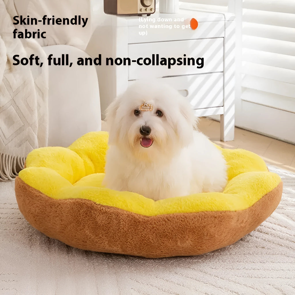 A thick grey and black plush round cat bed nest with raised sides on a wooden floor.