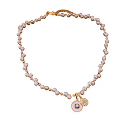 Gold plated clavicle necklace with round imitation pearl and zircon pendant on a 41-50cm chain.