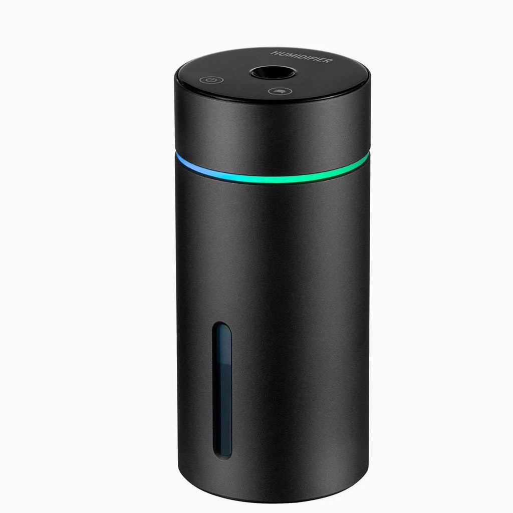 Compact aluminium car humidifier diffuser with colourful light and USB cable on a desk.