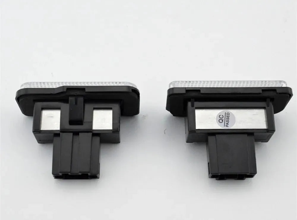 Mercedes Benz LED licence plate light unit with 18 white LEDs, shown next to a ruler for scale.