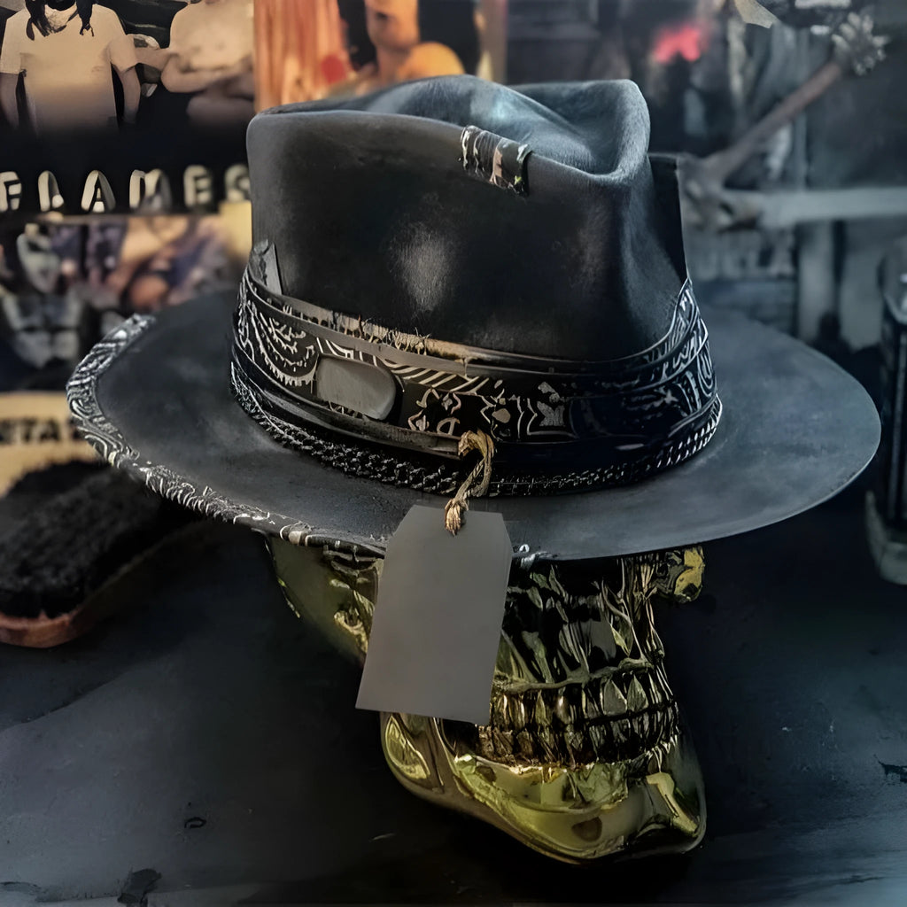 Handmade black and white skull print pointed witch hat on a wooden surface