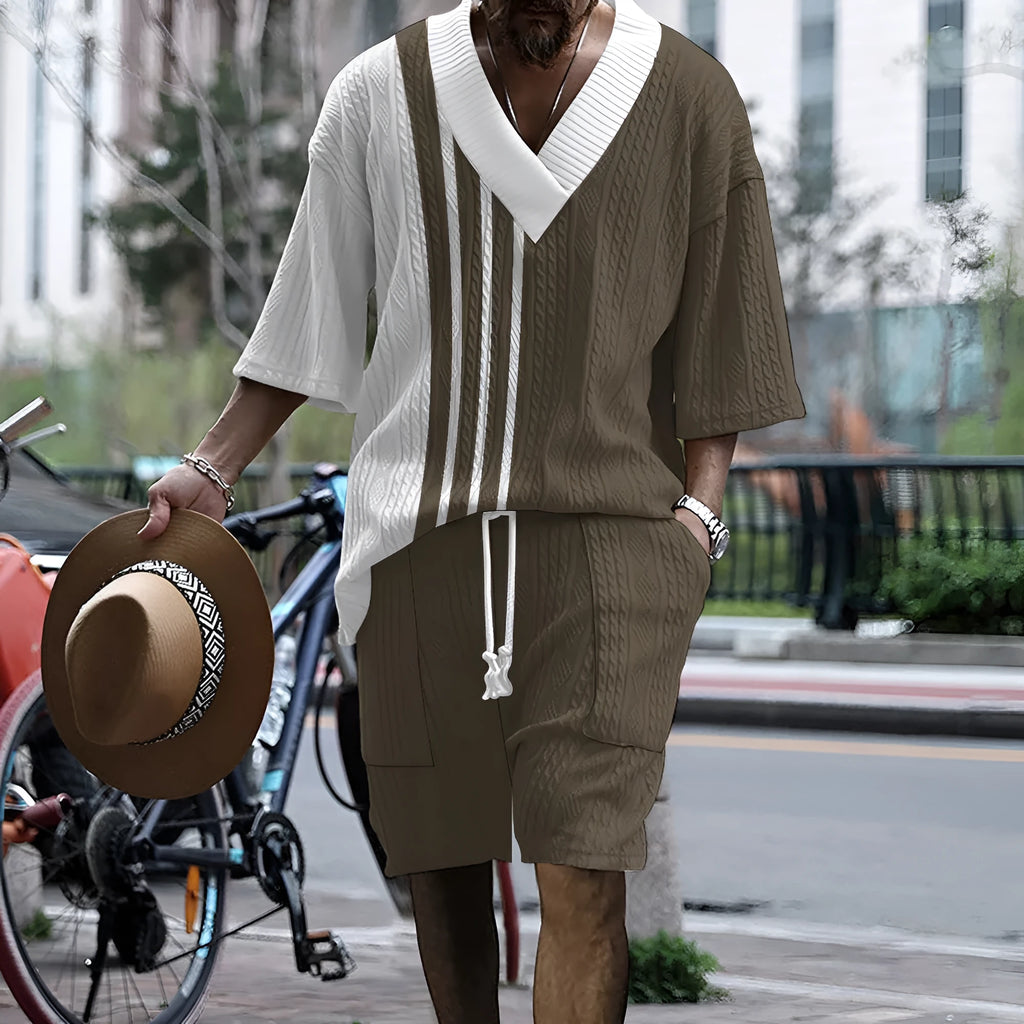 Men's grey knitted short-sleeved drop-shoulder top with matching shorts laid flat.