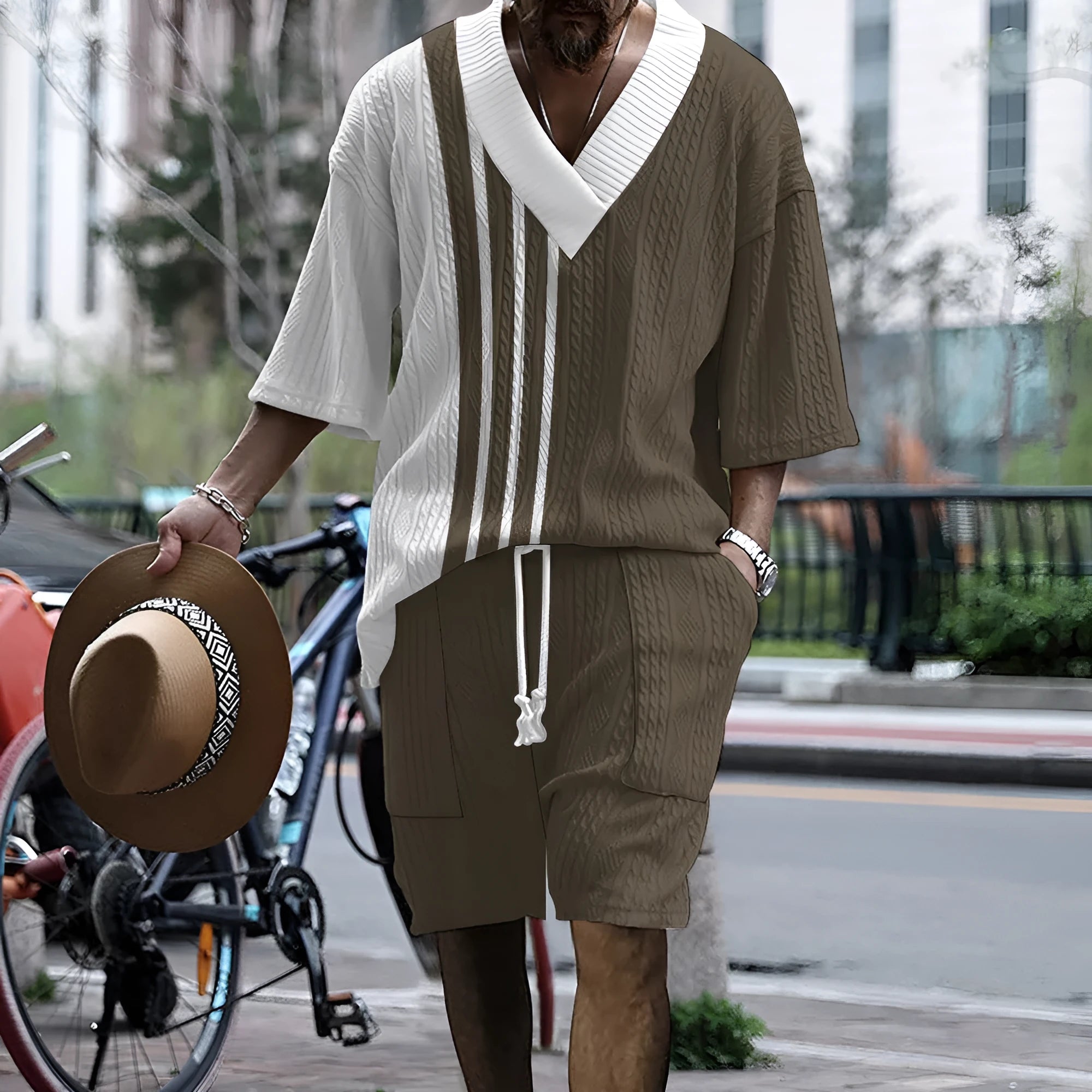 Men's grey knitted short-sleeved drop-shoulder top with matching shorts laid flat.