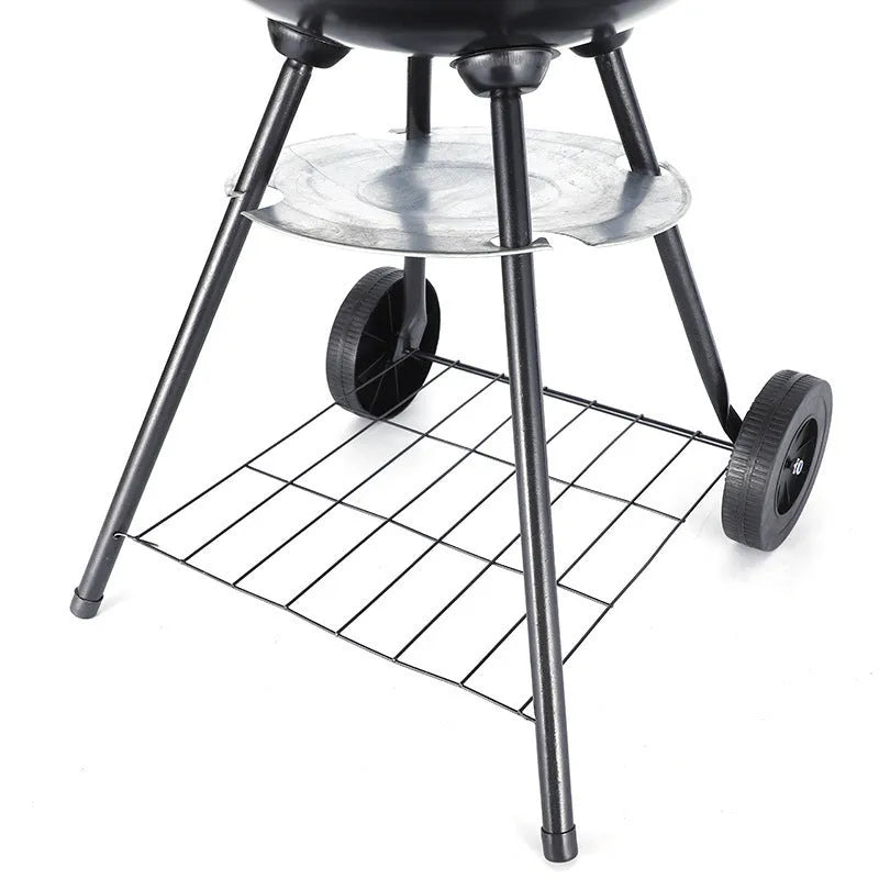Portable 14-inch iron barbecue grill with Apple stove design on a patio.