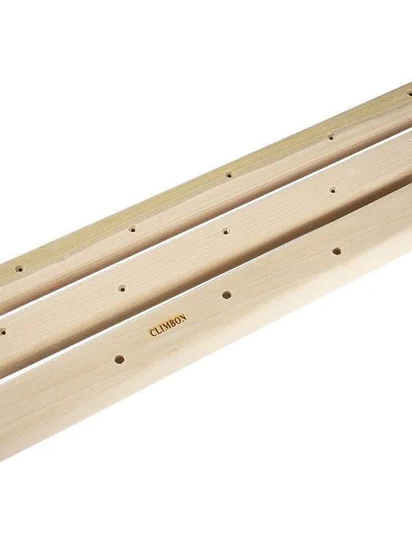 Set of three solid wooden fingerboards for grip strength training on a wall