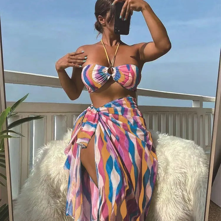 Women's printed beach bikini three-piece set with swimsuit top, briefs, and matching skirt in high-elasticity fabric