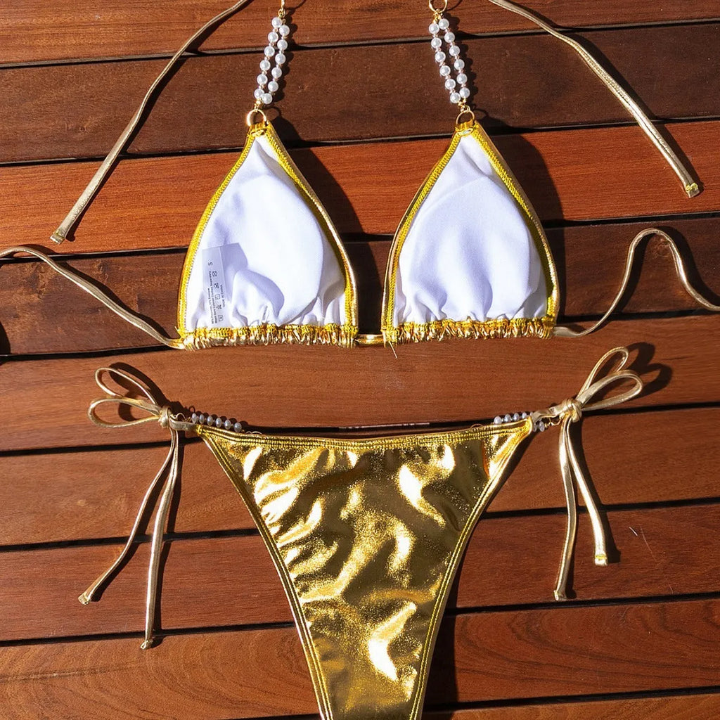 Gold halter lace-up bikini swimsuit with pearl chain detail, shown in Asian sizes