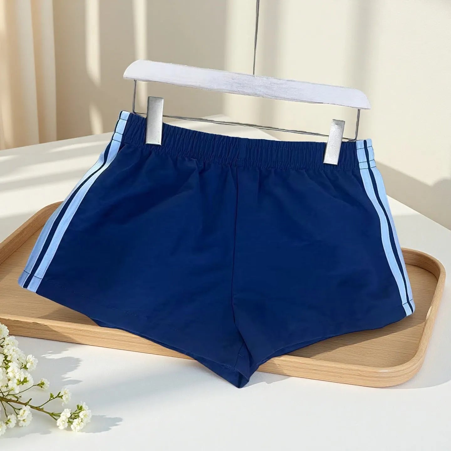 Navy blue men's nylon sport shorts with high-waist elastic waistband