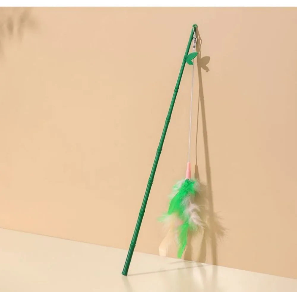 Green interactive cat feather wand toy with bells and a comfortable grip handle