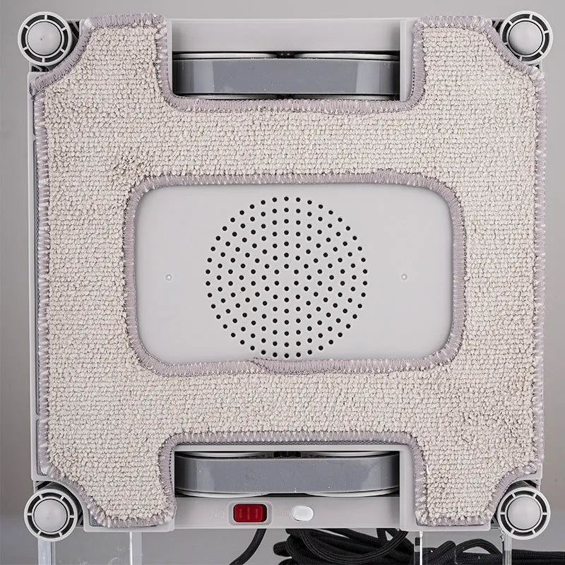 White intelligent window cleaning robot with four water spray heads for high-rise windows