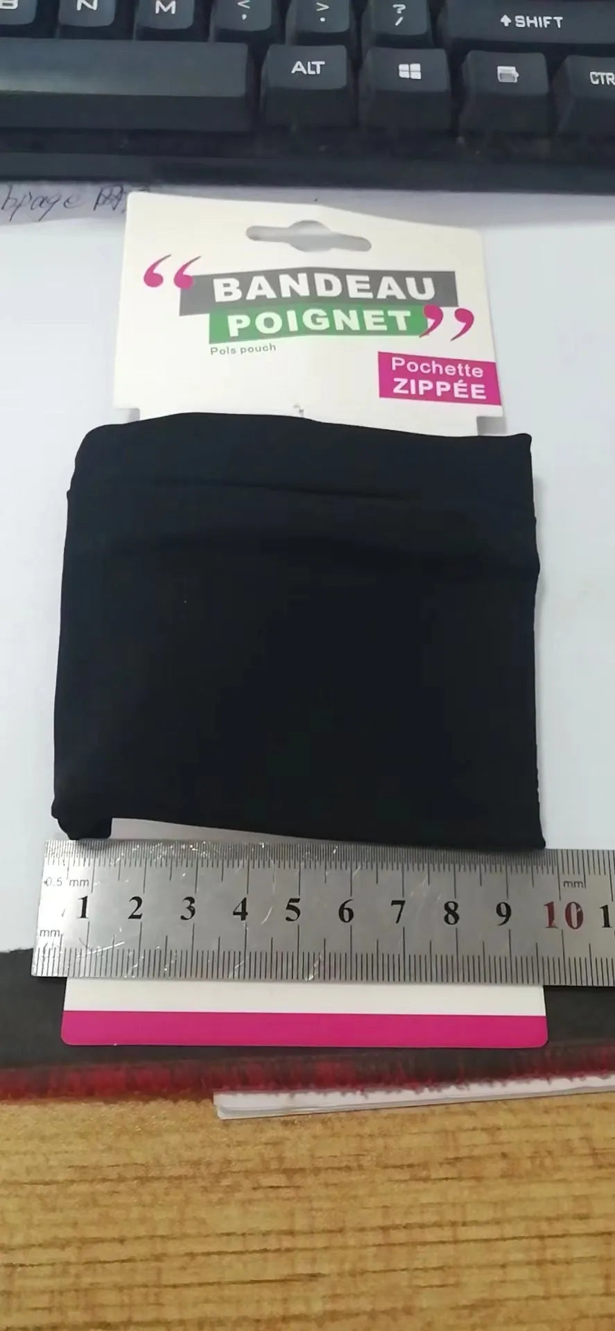 Wrist bag armband sleeve for mobile phone, showing 10x10.5cm dimensions and zipped closure.