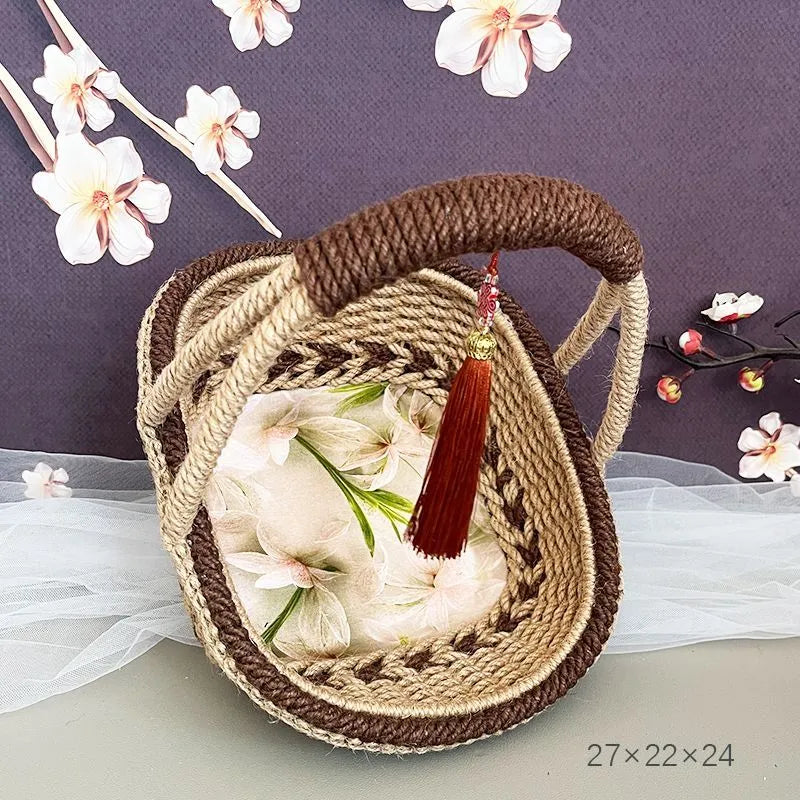 Coffee brown hand-woven straw basket with hemp rope accents measuring 19cm by 12cm