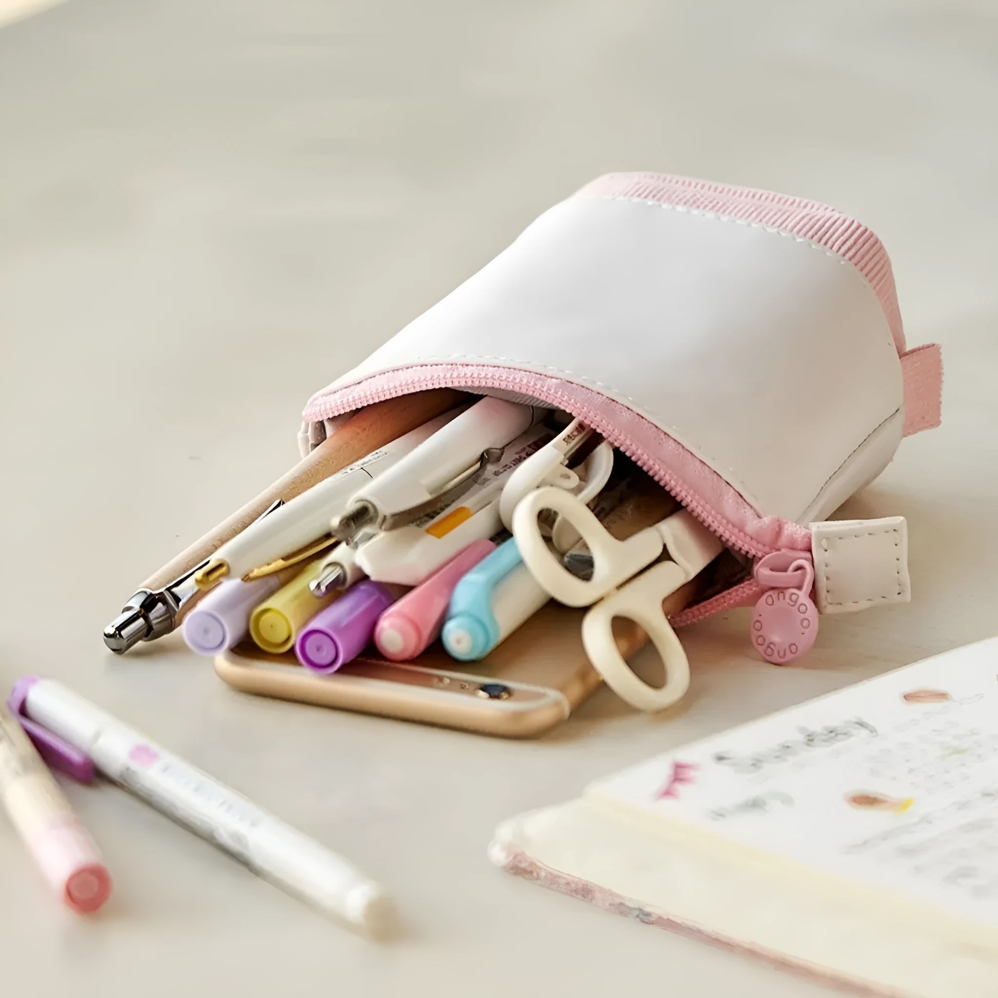 Soft PU corduroy telescopic pencil case in purple colour with drop-down open design.