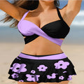 Black high-waist women's bikini with lace-up back and matching swim skirt laid flat.
