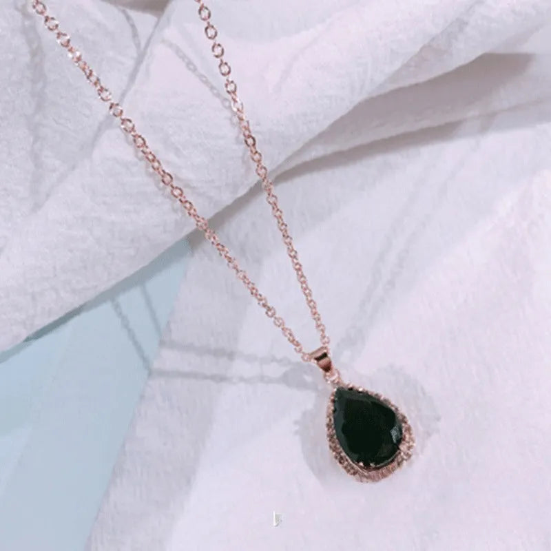 Rose gold geometric water drop pendant necklace with rhinestone inlay