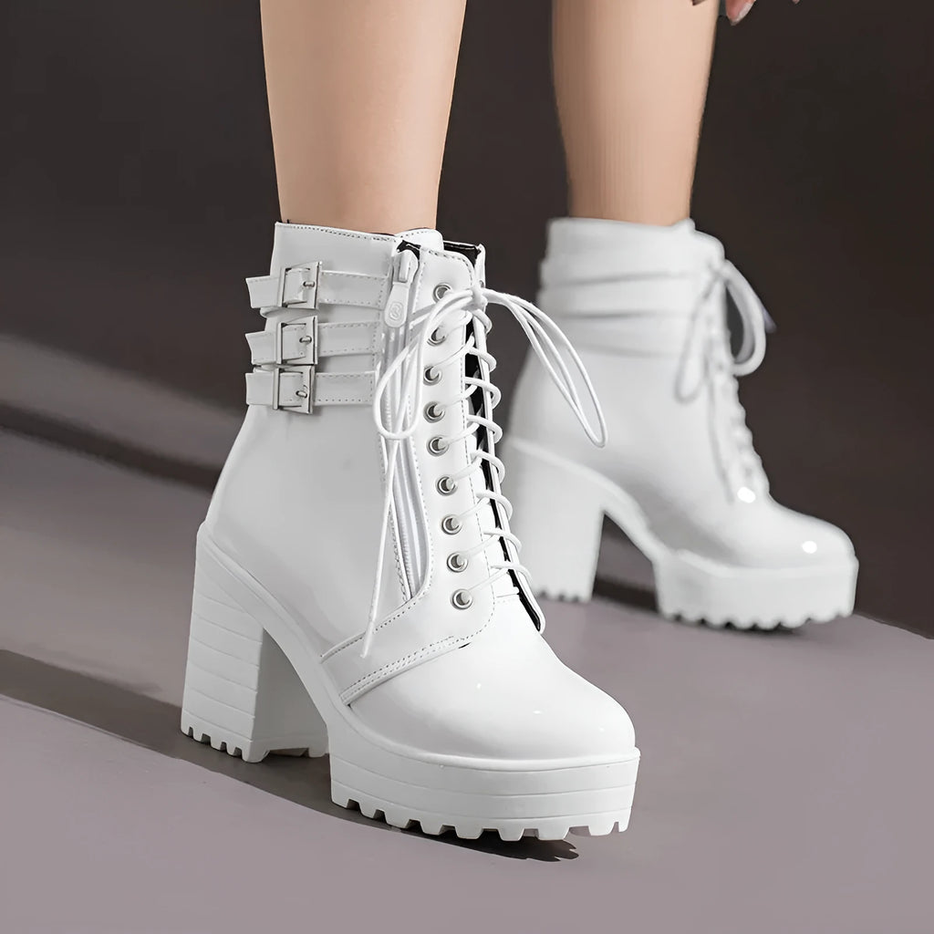 Women's black thick-heeled ankle boots with lace-up front and round toe on a waterproof platform