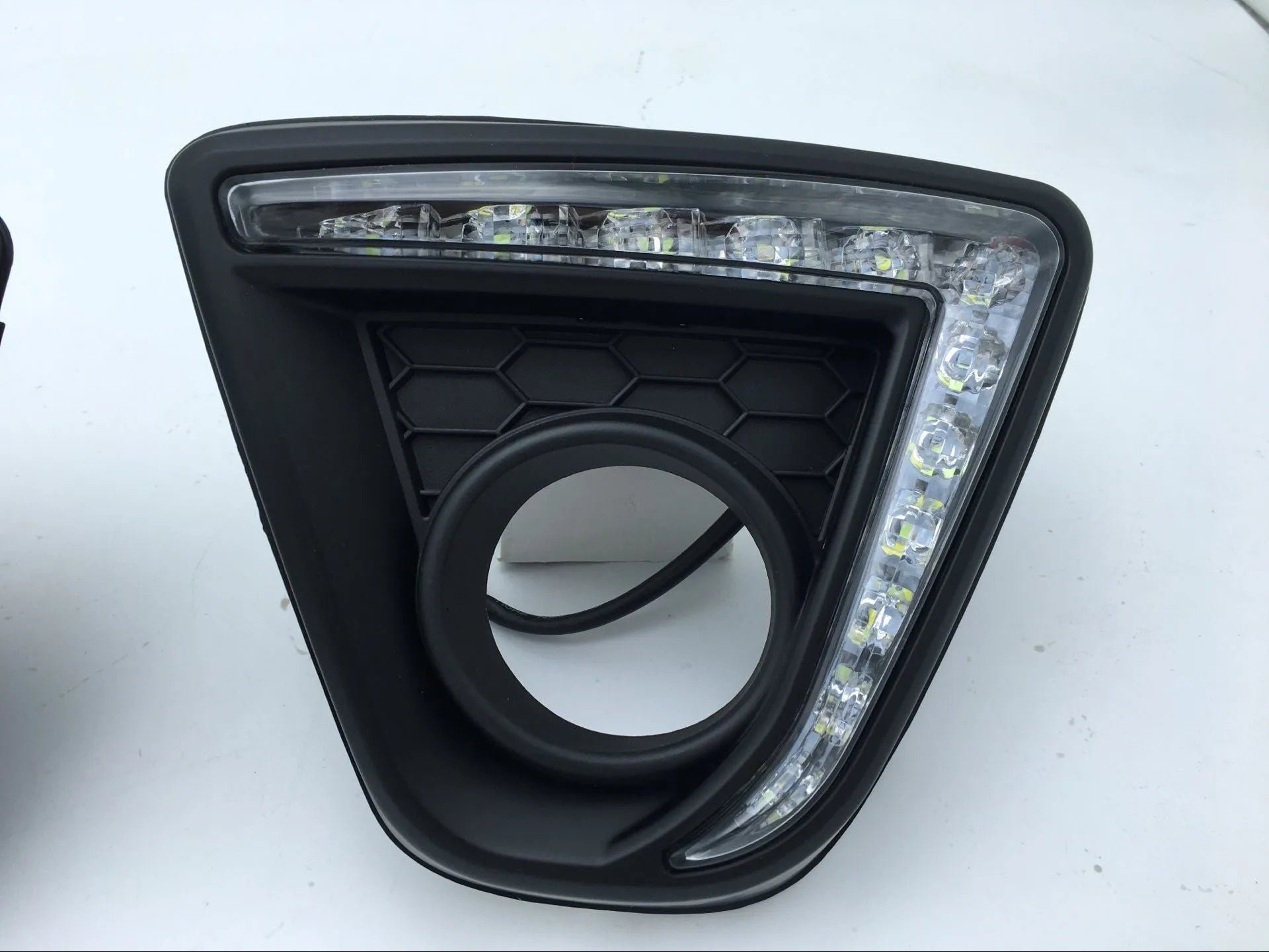Set of two silver electroplated daytime running light units for a Mazda CX-5 car.