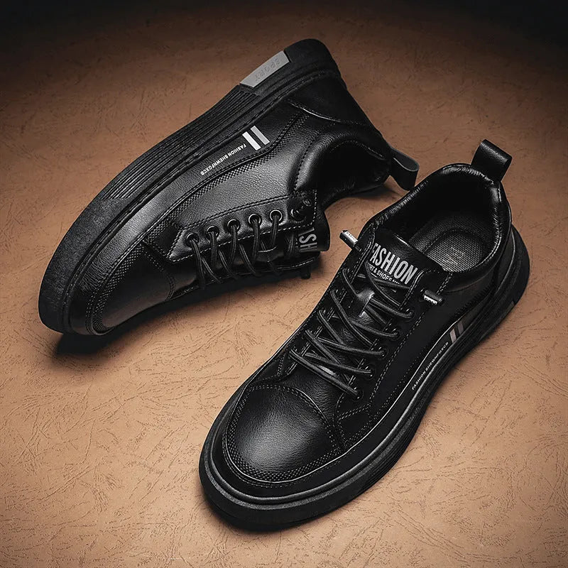 Men's white skate shoes with elastic band closure and low-top design showing stitching details