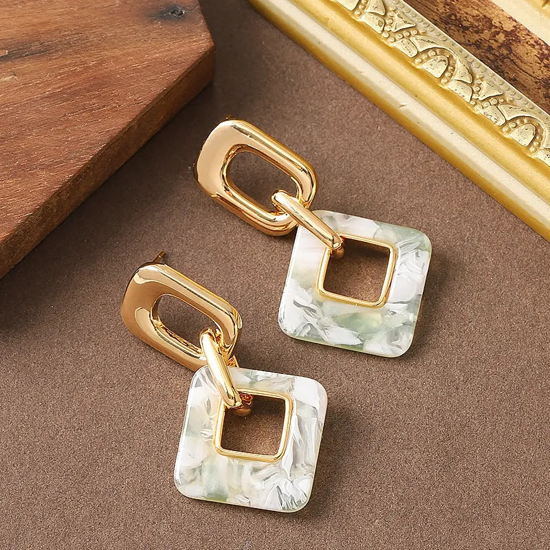 Copper hollow geometric square earrings with chamfered corners in gold or blue electroplated finish