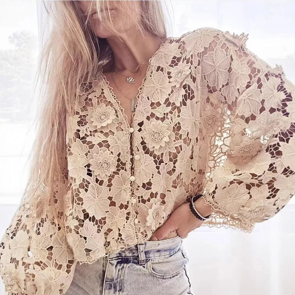 Loose black lace V-neck cardigan with a three-dimensional lace flower decoration on the chest.