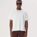 Pure cotton loose fit American style T-shirt in apricot colour on a hanger.