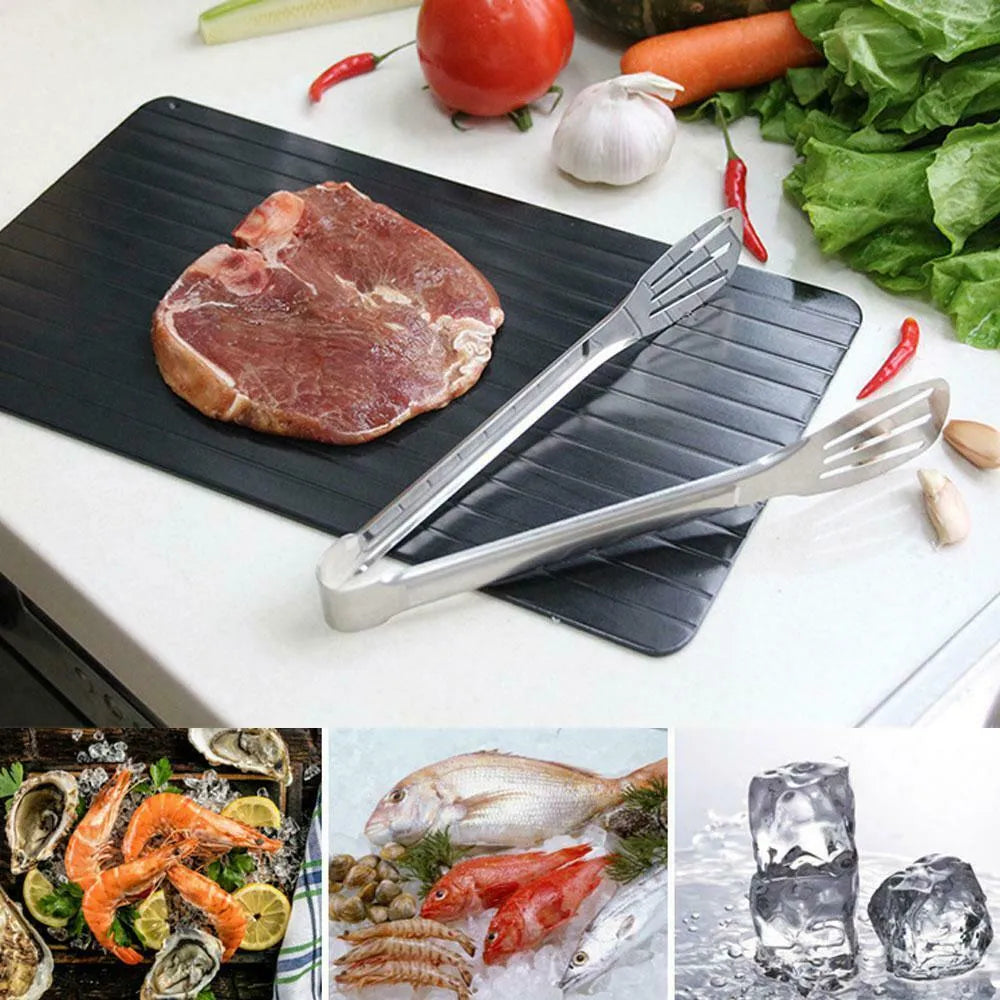 Black rectangular aluminium fast defrost tray for thawing frozen food on a kitchen counter.