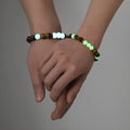 Geometric amber couple bracelets with luminous retro styling on display