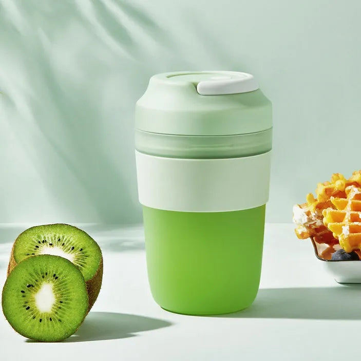 Portable 400ml blender juicer cup with four stainless steel blades in purple, green, or orange colours