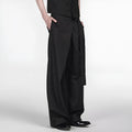 Black straight-leg trousers with a single pleat and adjustable waistband on a hanger.