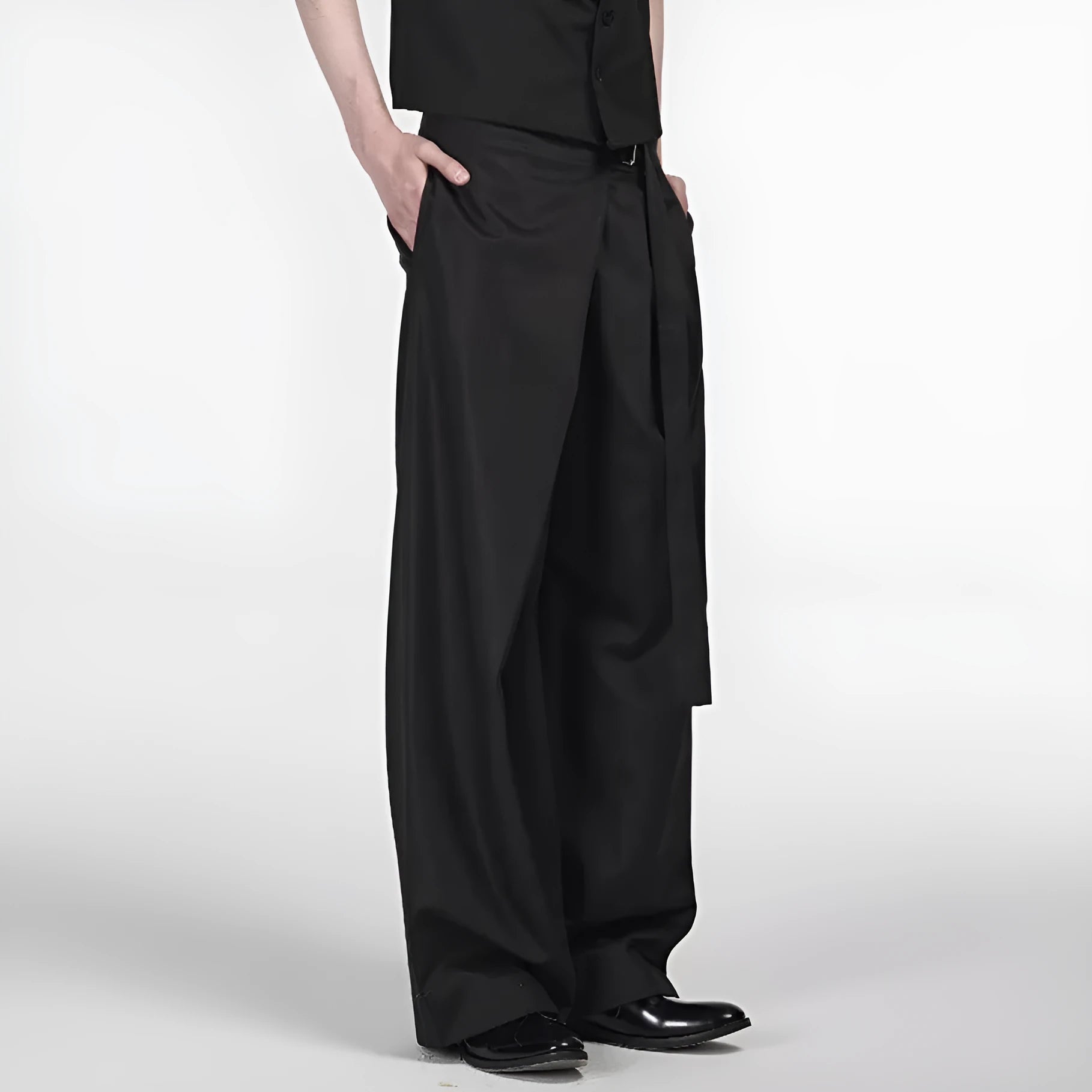 Black straight-leg trousers with a single pleat and adjustable waistband on a hanger.