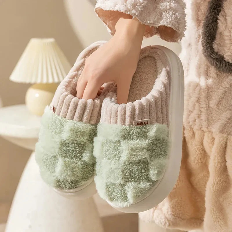 Women's plaid plush slippers in coffee colour with a soft upper, plush lining, and textured PVC sole.