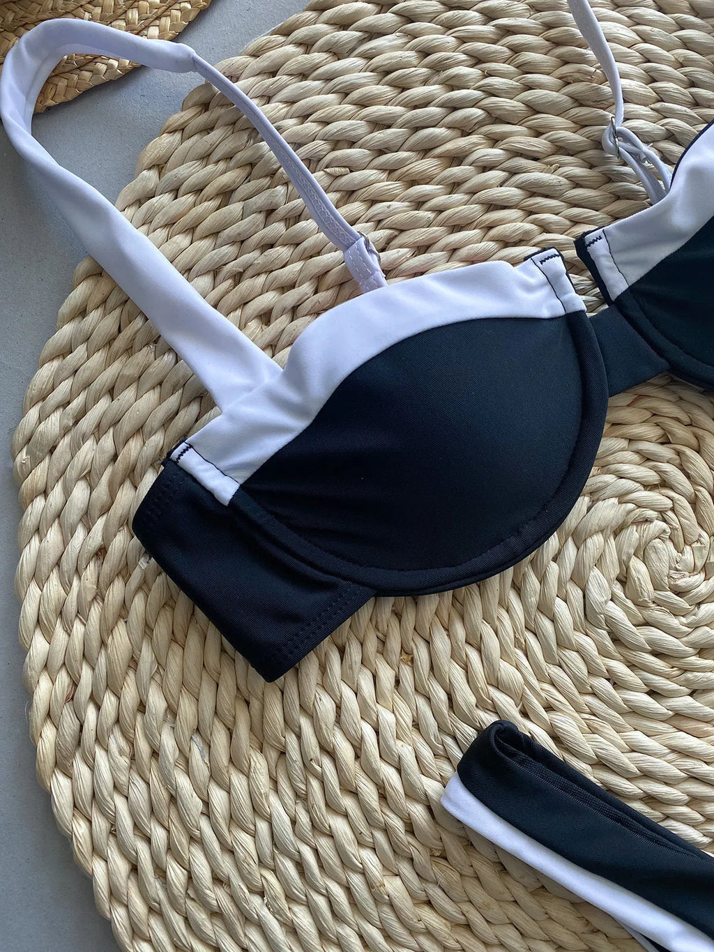 Black women's bikini with stitching detail showing front and back views