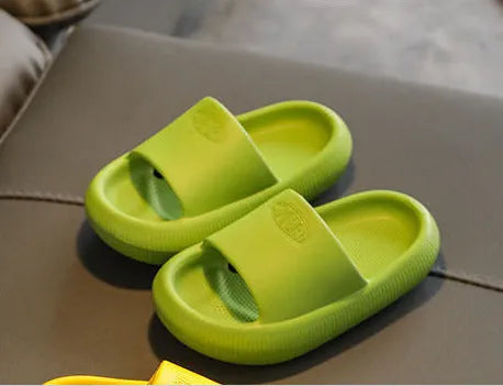 Children's colourful EVA slippers with a textured non-slip sole, shown in a mixed colour selection.