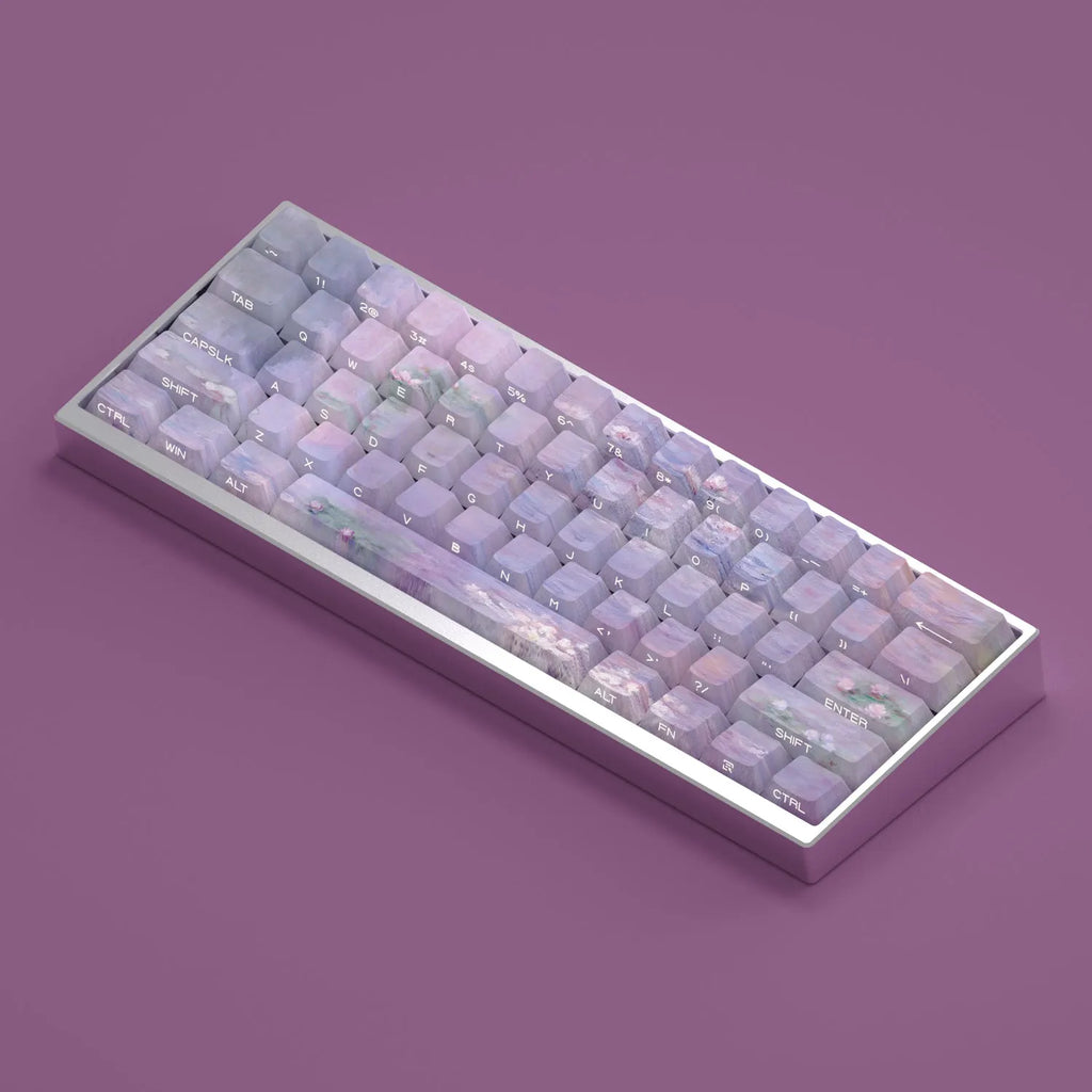 Set of white PBT keycaps with colourful water lily design on top and sides, showing side-engraved transparent characters.