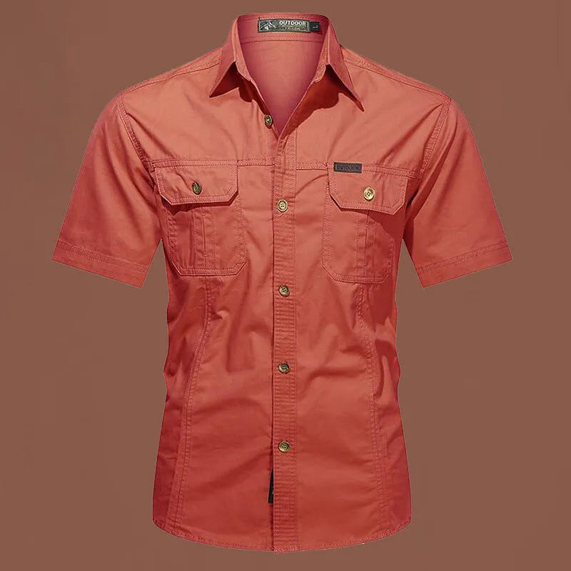 Man wearing a loose-fit army green short sleeve cotton work shirt with a cardigan style.
