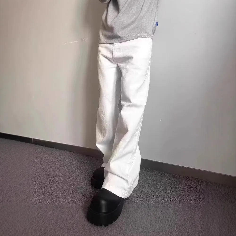 Men's white straight wide-leg denim jeans on a mid waist, showing zipper fly and relaxed fit.