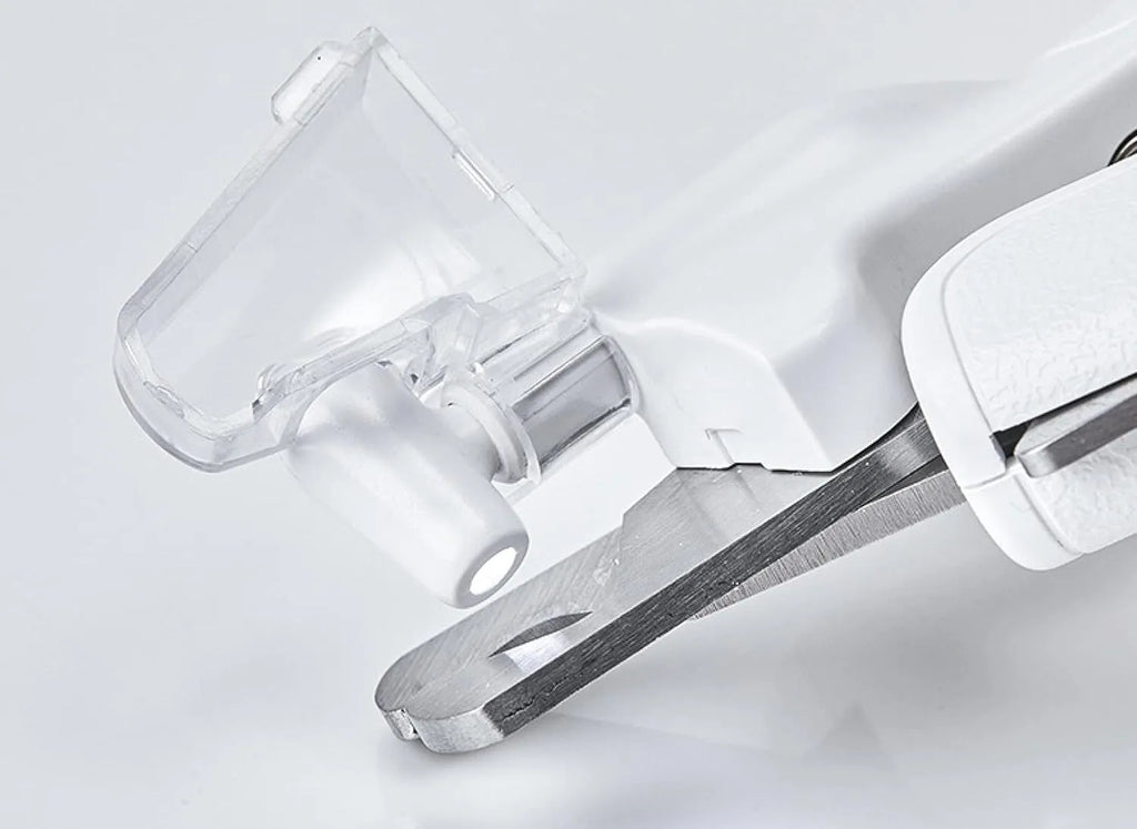 White LED pet nail clippers with a transparent guard open, showing the triangular blade and integrated nail file.