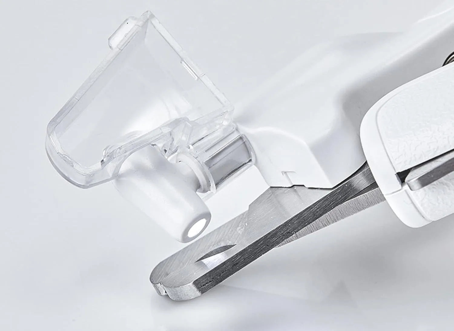 White LED pet nail clippers with a transparent guard open, showing the triangular blade and integrated nail file.