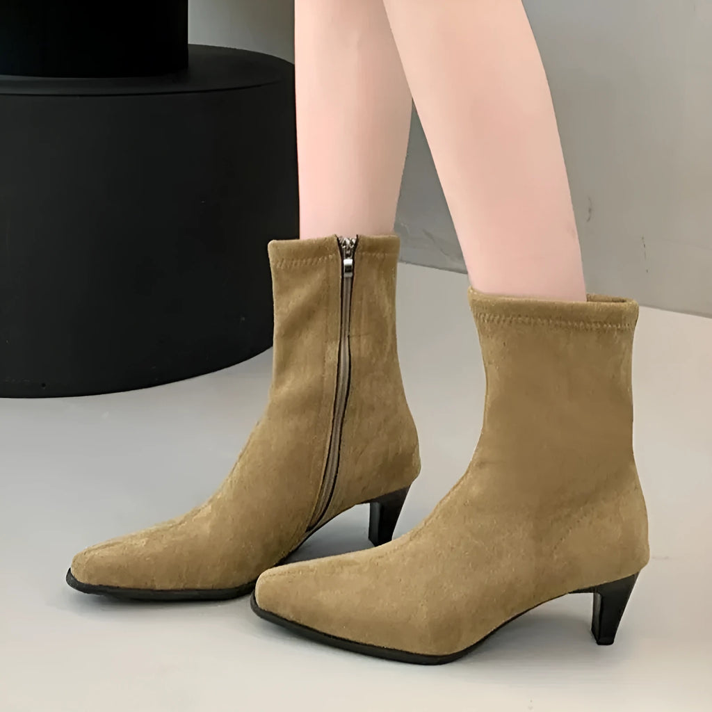 Brown square toe high heel ankle boots with a side zip and a stiletto kitten heel.